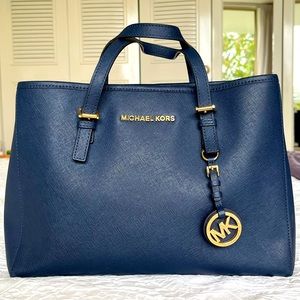 Micheal Kors Navy leather look Handbag with shoulder strap. 12”x 8.5”
